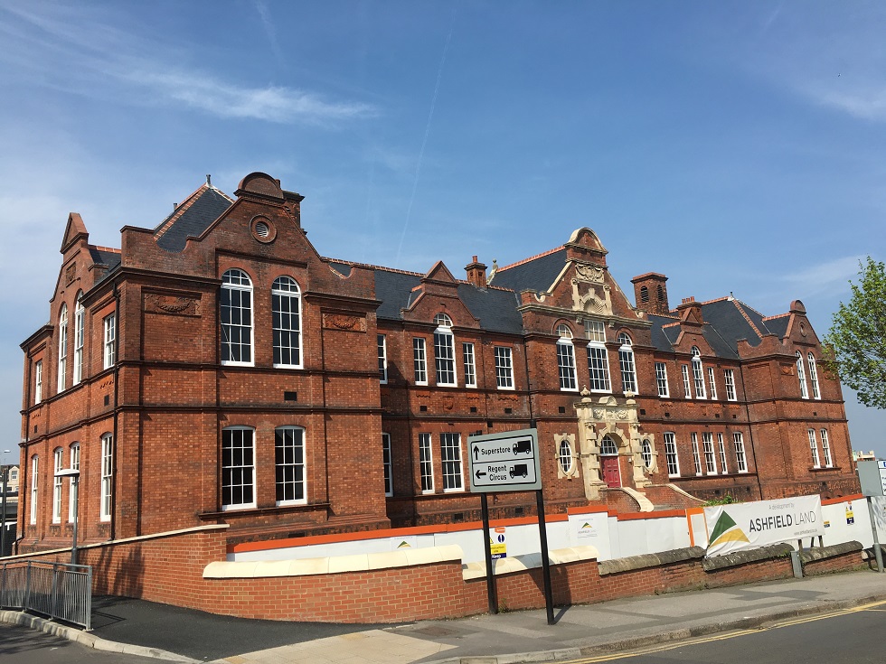 Large red brick building roofing project